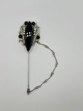 SPILLA DA CRAVATTA VINTAGE “NOIR ARISTRICAT” CON CABOCHON NERO E STRASS – ANNI 80