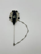 SPILLA DA CRAVATTA VINTAGE “NOIR ARISTRICAT” CON CABOCHON NERO E STRASS – ANNI 80