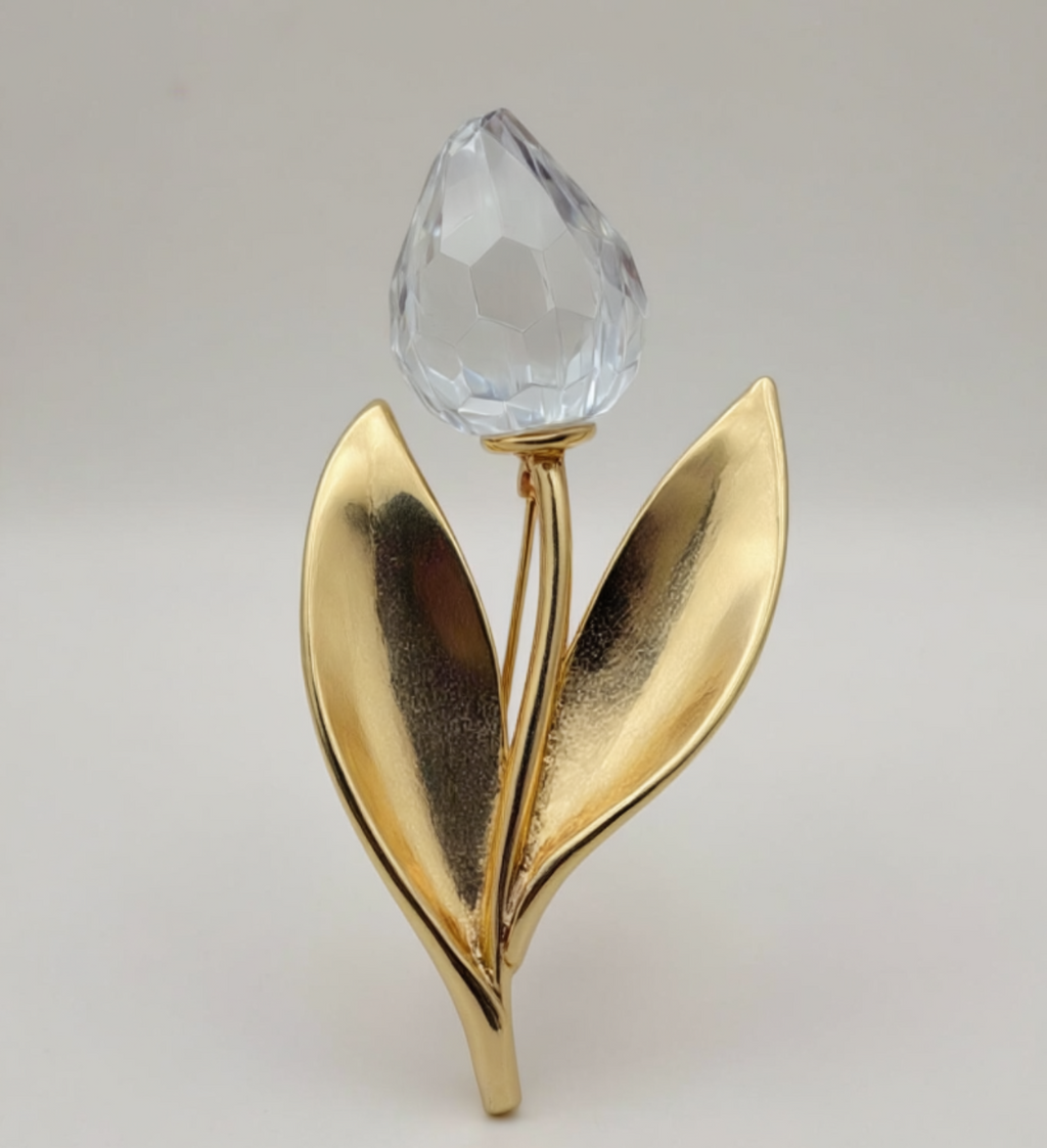 SPILLA VINTAGE SWAROVSKI CON FIORE STILIZZATO CRISTALLO SFACCETTATO E FOGLIE DORATE - ANNI ’80